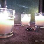 A close up of two candles on a table