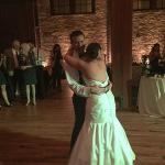 A bride and groom dance on the dance floor