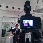 A video camera recording a wedding party