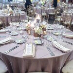 A table set for a formal dinner with silverware and napkins