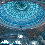 A domed ceiling with a chandelier and chandelier hanging from the ceiling