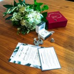 A bouquet of flowers and jewelry on a table