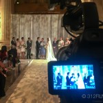 A video camera recording a wedding ceremony