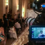 A video camera recording a wedding ceremony