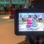 A video camera recording a show in a mall