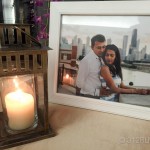 A picture of a man and a woman next to a lit candle