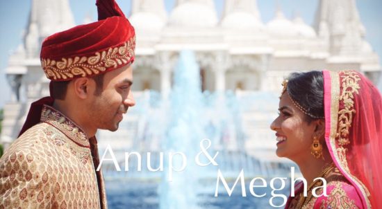 Indian man and a woman standing next to each other in front of a fountain Baps Wedding