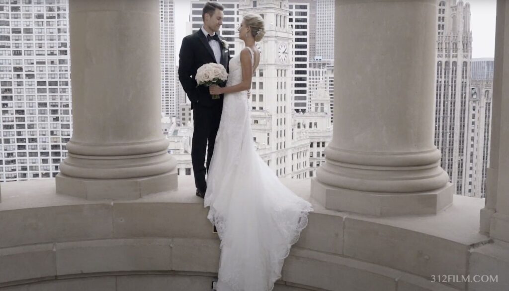 A couple having their wedding photos taken at the Cupola of the LondonHouse Chicago on their wedding day.
