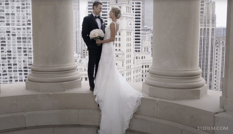 A couple having their wedding photos taken at the Cupola of the LondonHouse Chicago on their wedding day.