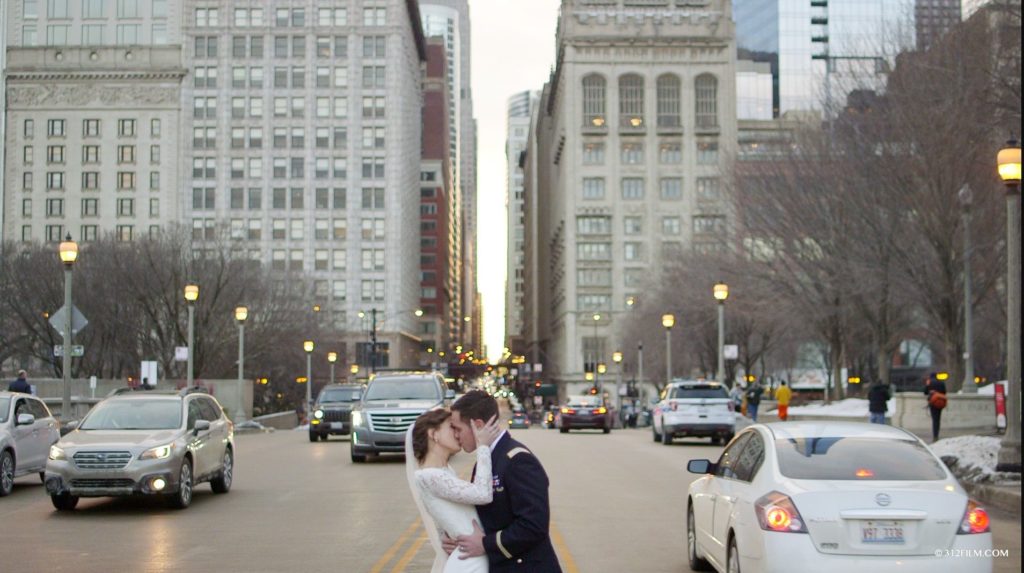 A bride and groom kissing in Madison Street, Chicago.
