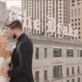 Bride & Groom at The Drake Chicago Rooftop with the Drake Sign