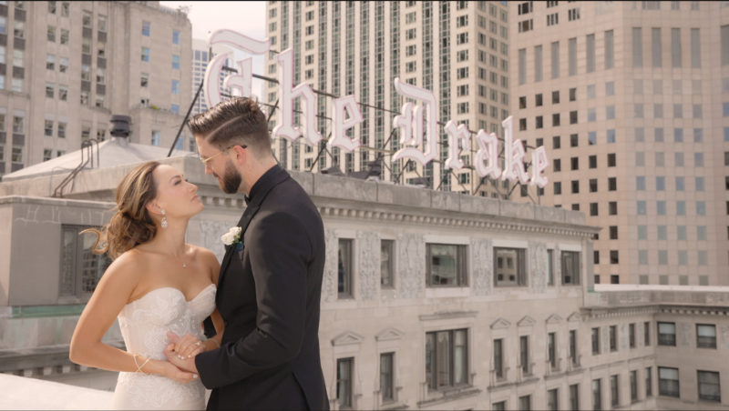 Bride & Groom at The Drake Chicago Rooftop with the Drake Sign