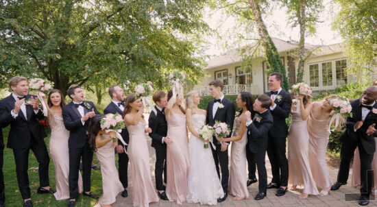 Gen and Ryan taking the wedding pictures with their wedding party at the Saddle & Cycle Club in Chicago