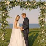 Bride & groom in the flower arch by the Lake Michigan lakeshore