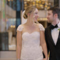 A bride and groom smile at each other in Langham hotel Chicago