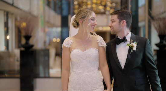 A bride and groom smile at each other in Langham hotel Chicago