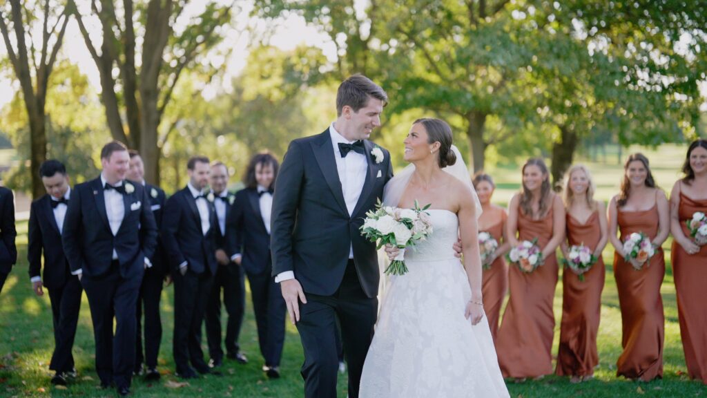 This is a couple taking pictures with the bridal party at a wedding at the Glenview Club.