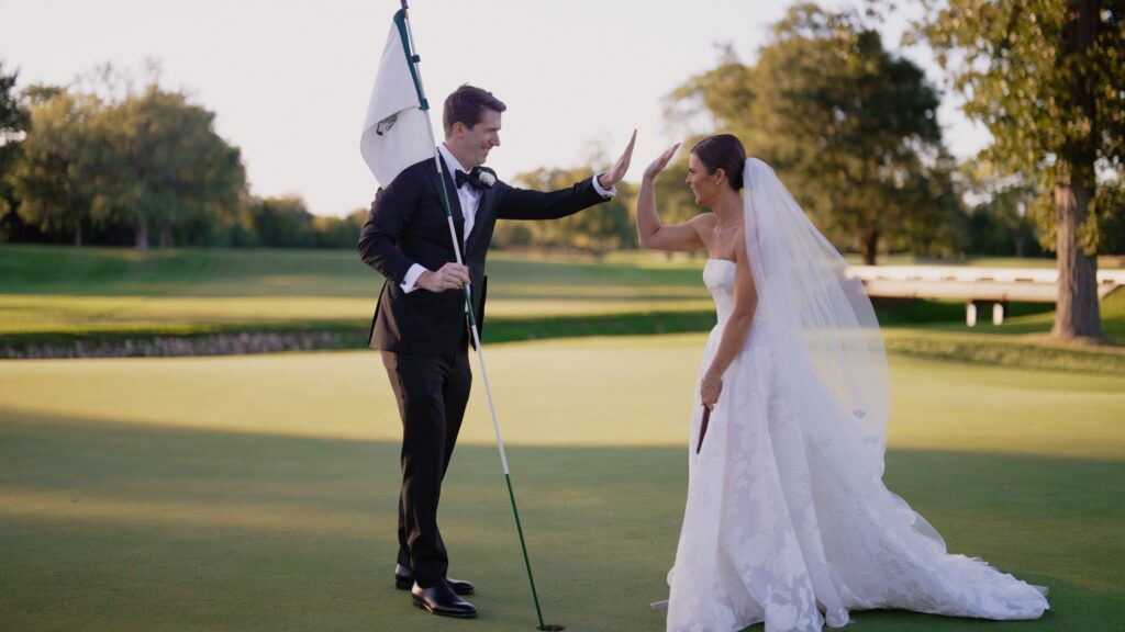 A couple taking pictures at the Glenview Club wedding.