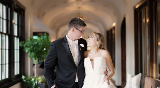 Bride and groom walking in the Lake Shore Country Club
