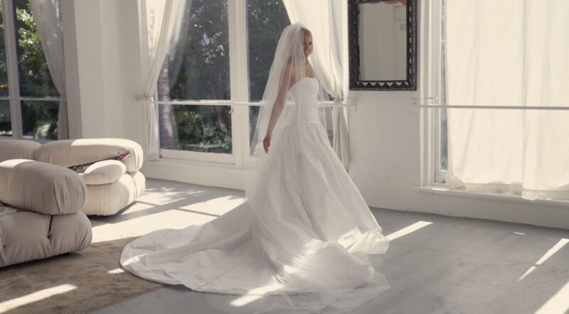 The bride is wearing a wedding dress and gown at the Subtle Haus in Chicago.