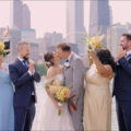 The bride and groom with their bridal party at the iconic wedding photo spot in Chicago: Olive Park.