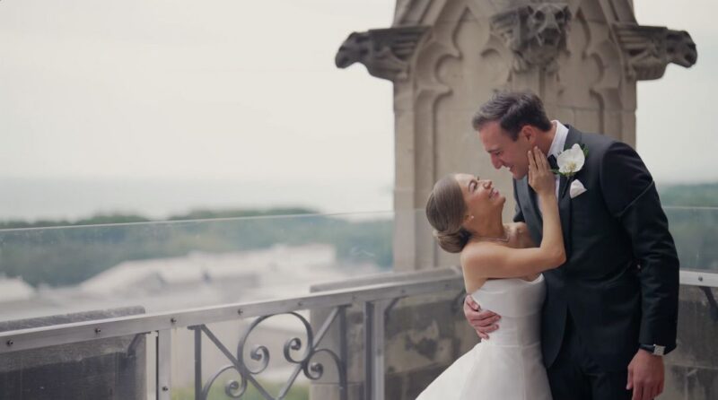 The bride and groom on the balcony of the University Club of Chicago during the 'first look'.