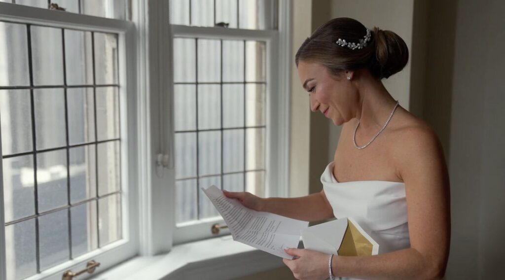 The bride reads the groom's letter in the morning at the University Club of Chicago. 