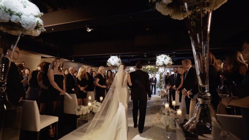 The bride walks down the aisle at RPM Events in Chicago.