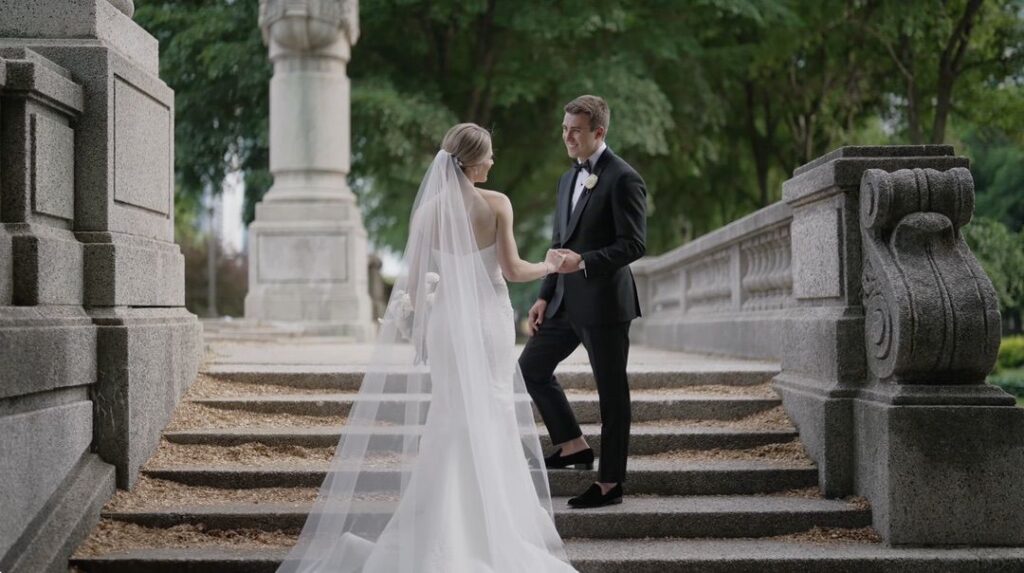 The bride and groom are taking wedding photos near the Art Institute of Chicago.
