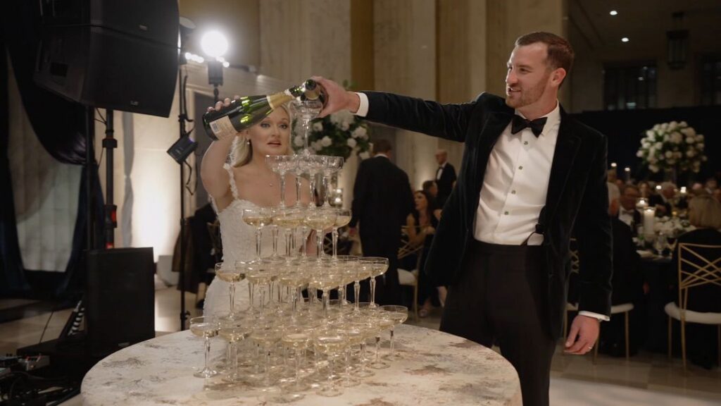 The bride and groom are doing a champagne tower at TOPO Chicago, created by Limelight Catering.
