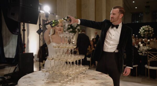 The bride and groom are doing a champagne tower at TOPO Chicago, created by Limelight Catering.